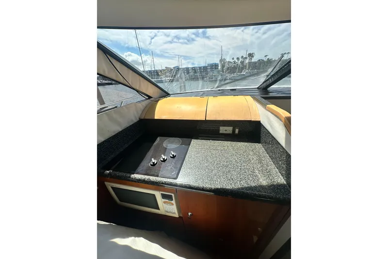 Slide: The Image of Interior view of 2002 Fairline 50 yacht kitchen with stove and microwave. - 15