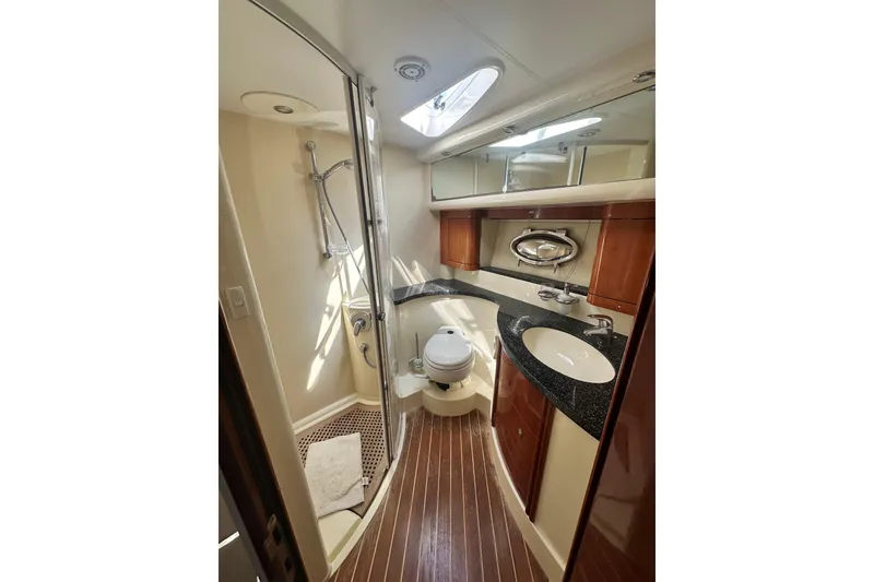 Slide: The Image of Luxurious bathroom in 2002 Fairline 50 yacht with modern fixtures and wood accents. - 20