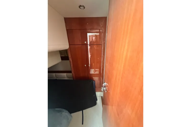 Slide: The Image of Interior view of 2002 Fairline 50 yacht with wooden cabinetry and seating. - 9