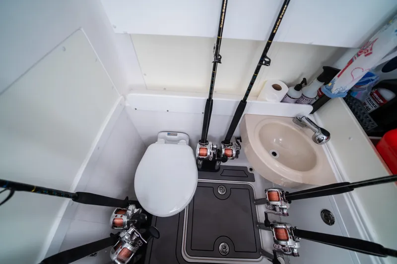 Slide: The Image of Interior of 2020 Invincible 36 Open Fisherman with fishing rods and sink. - 15
