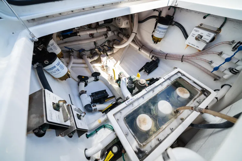 Slide: The Image of 2020 Invincible 36 Open Fisherman boat engine compartment with various mechanical components. - 23