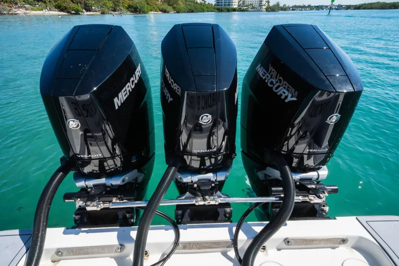 Slide: The Image of Triple Mercury Verado engines on a 2020 Invincible 36 Open Fisherman boat. - 25