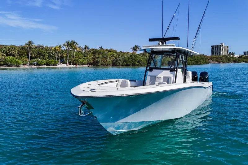 Slide: The Image of 2020 Invincible 36 Open Fisherman on blue water near tropical shoreline. - 26