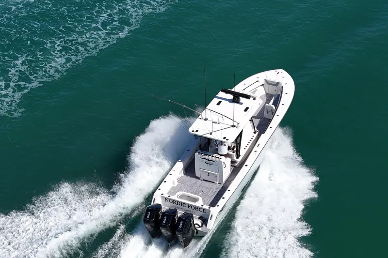 Slide: The Image of Invincible 36 Open Fisherman 2020, interior view with cover, docked. - 3