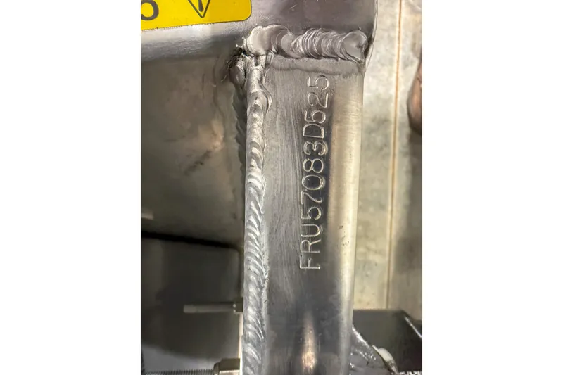 Slide: The Image of Close-up of a 2025 Trifecta 22UL LE metal part with serial number FRU57083D525. - 10