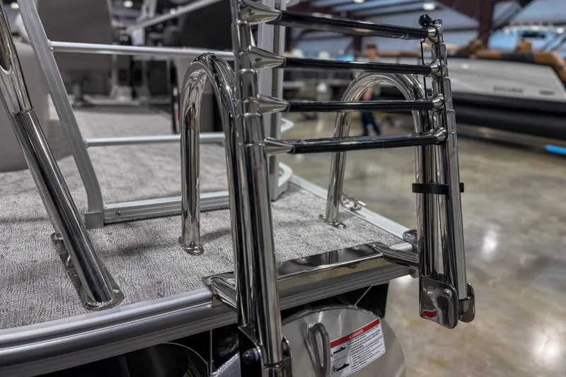Slide: The Image of Stainless steel ladder on 2025 Trifecta 22UL LE boat, displayed indoors. - 9