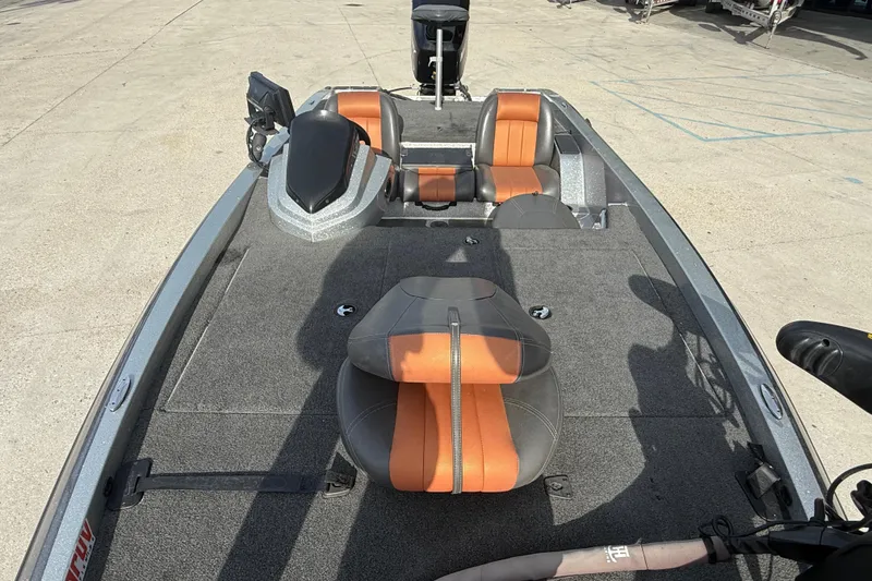 Slide: The Image of 2013 Stratos 176 VLO boat interior with orange and gray seating, carpeted deck. - 10