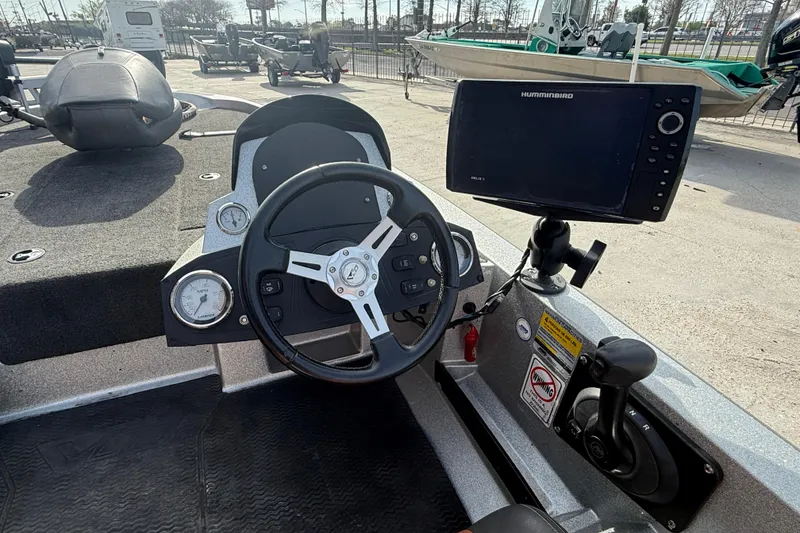 Slide: The Image of Steering console of 2013 Stratos 176 VLO boat with Humminbird electronics. - 12