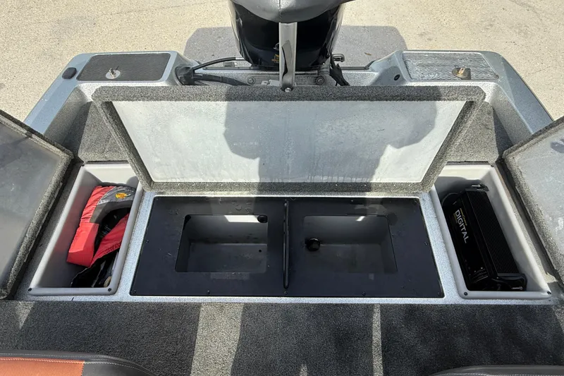 Slide: The Image of Open storage compartments on a 2013 Stratos 176 VLO boat, showing equipment and accessories. - 13