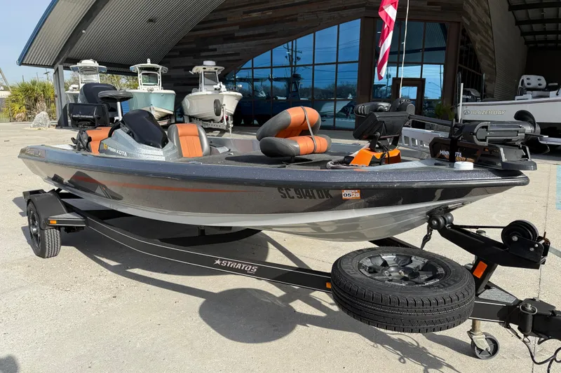 Slide: The Image of 2013 Stratos 176 VLO fishing boat on trailer, parked outside a showroom. - 2