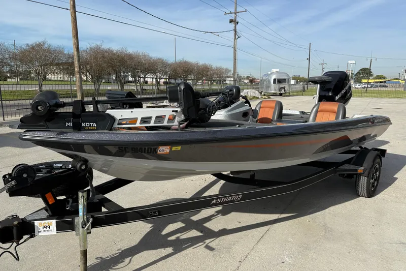 Slide: The Image of 2013 Stratos 176 VLO fishing boat on trailer, featuring Minn Kota Ultrex motor. - 3