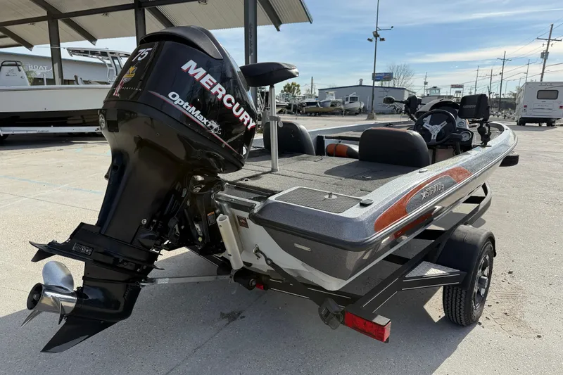 Slide: The Image of 2013 Stratos 176 VLO boat with Mercury OptiMax engine, parked outdoors. - 6
