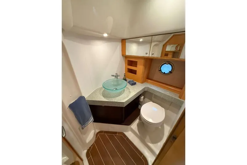 Slide: The Image of Luxurious bathroom in 2009 Cranchi Mediterranee 43 yacht with modern fixtures and porthole window. - 14