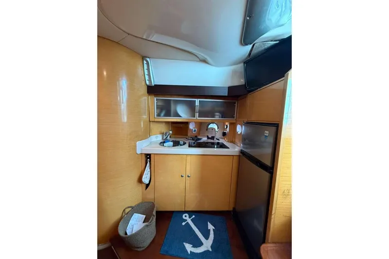 Slide: The Image of Compact kitchen area in 2009 Cranchi Mediterranee 43 yacht with modern amenities. - 15