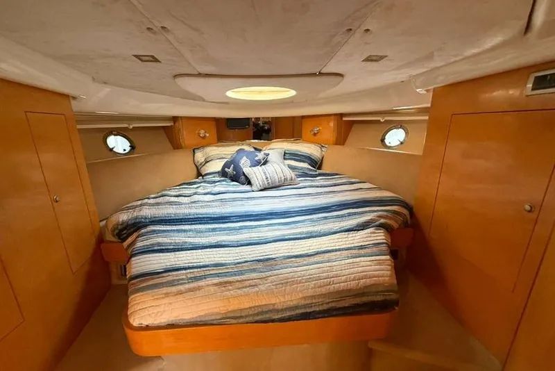 Slide: The Image of Luxurious cabin interior of 2009 Cranchi Mediterranee 43 yacht with cozy bedding. - 19