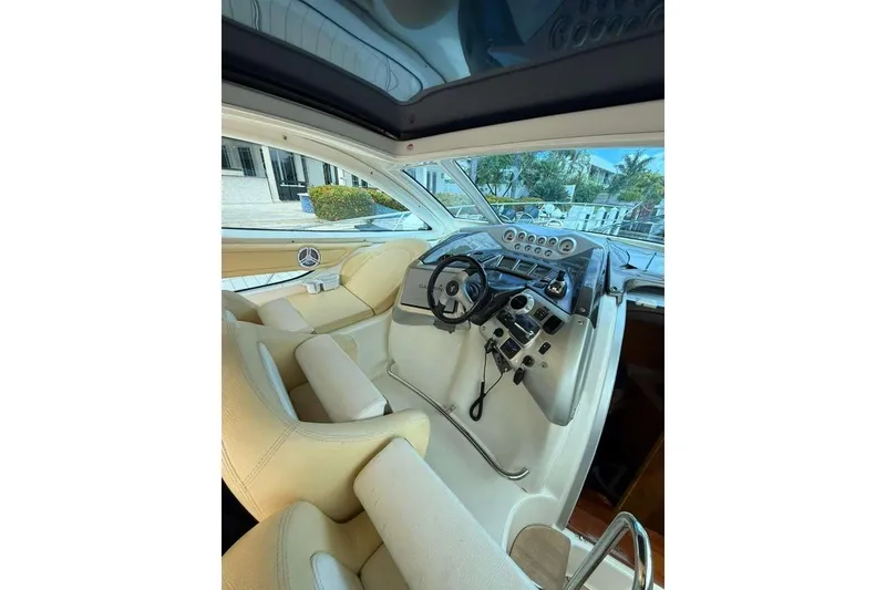 Slide: The Image of Interior of 2009 Cranchi Mediterranee 43 yacht, featuring a modern helm and luxurious seating. - 25