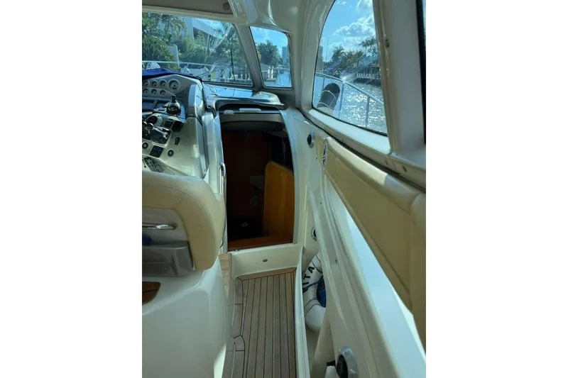Slide: The Image of Interior view of 2009 Cranchi Mediterranee 43 yacht, showcasing helm and seating area. - 6