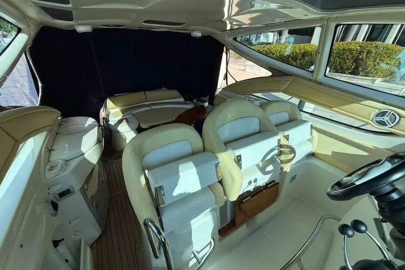 Slide: The Image of Interior of 2009 Cranchi Mediterranee 43 yacht with beige seating and steering wheel. - 8