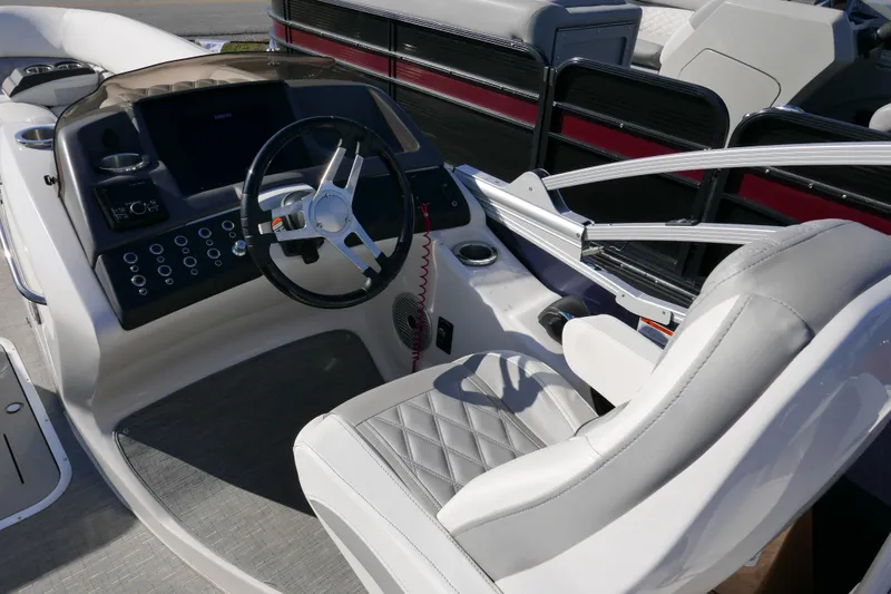 Slide: The Image of 2022 Bennington 23 RCW boat interior with steering wheel and luxurious seating. - 11