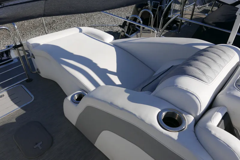 Slide: The Image of Luxurious seating on 2022 Bennington 23 RCW boat with cup holders and sleek design. - 14