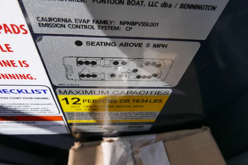 Slide: The Image of 2022 Bennington 23 RCW capacity label, seating diagram, and safety instructions. - 17
