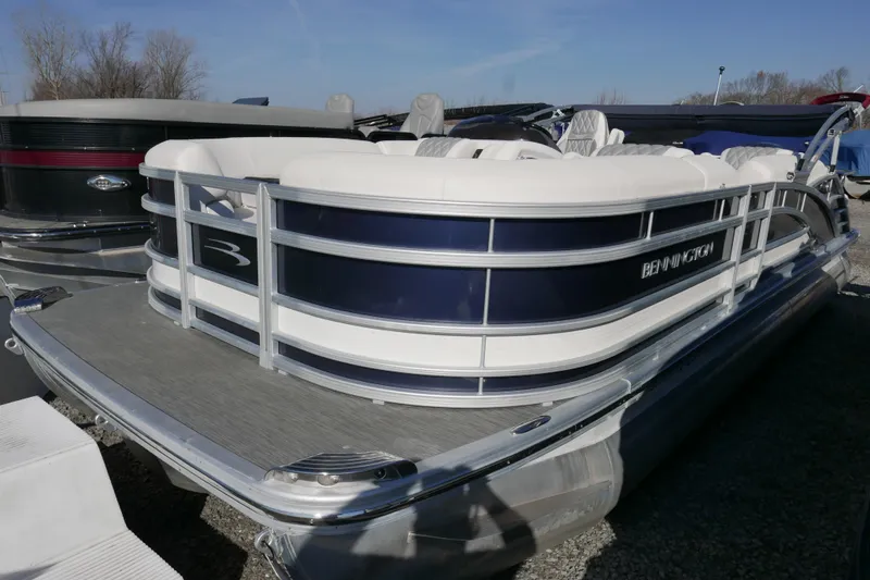 Slide: The Image of 2022 Bennington 23 RCW pontoon boat with sleek design and comfortable seating. - 2