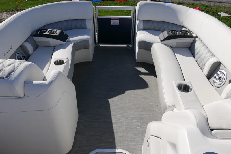 Slide: The Image of Luxurious seating on 2022 Bennington 23 RCW pontoon boat with cup holders and speakers. - 7