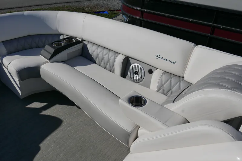 Slide: The Image of Luxurious seating on 2022 Bennington 23 RCW boat with cup holders and speaker. - 8