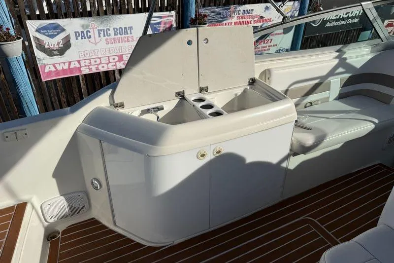 Slide: The Image of 1999 Formula 280 Sun Sport boat interior with sink and seating area. - 5