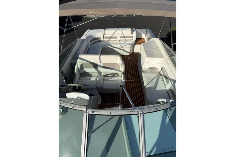 Slide: The Image of 1999 Formula 280 Sun Sport boat interior with white seating and wooden flooring. - 6