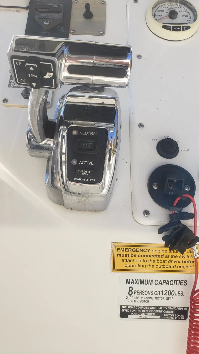 Slide: The Image of Control console of a 2009 Triton 225 CC boat. - 10