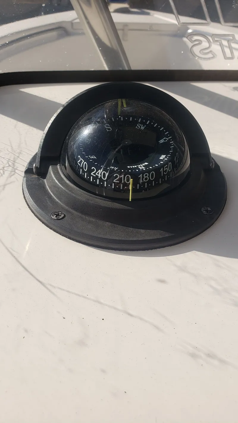 Slide: The Image of Compass on Triton 225 CC boat, year 2009. - 13