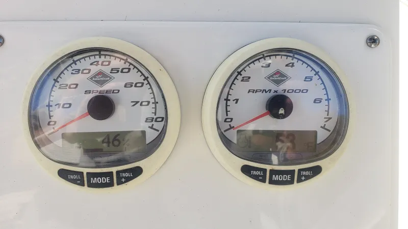 Slide: The Image of Triton 225 CC 2009 boat gauges, speedometer and tachometer. - 14