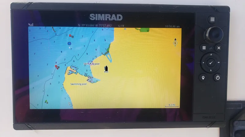 Slide: The Image of Simrad GPS chartplotter on Triton 225 CC boat, 2009 model. - 16