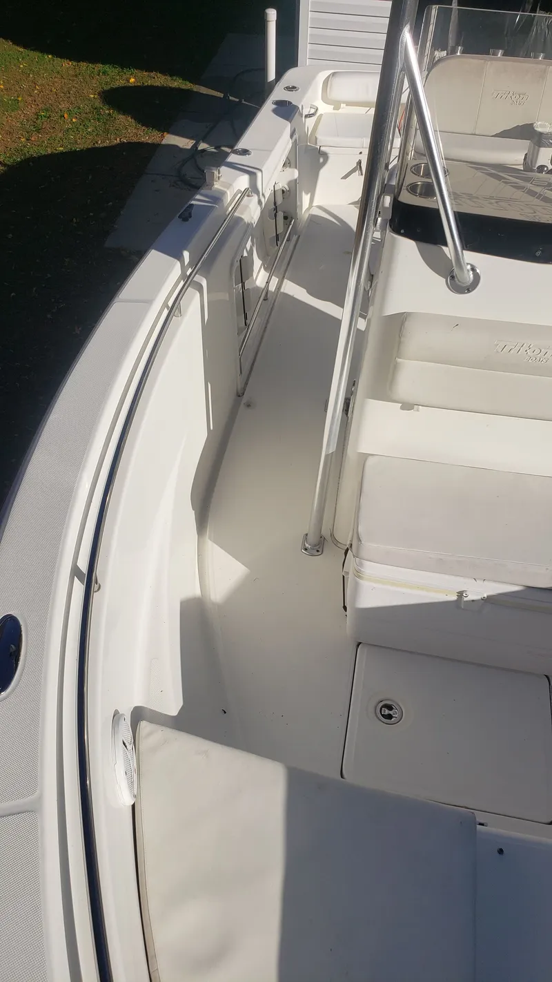 Slide: The Image of Interior view of a 2009 Triton 225 CC boat. - 17