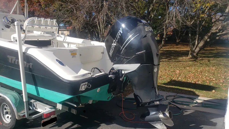 Slide: The Image of 2009 Triton 225 CC boat with Mercury outboard motor. - 3