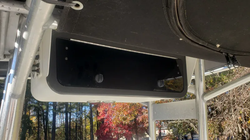 Slide: The Image of Triton 225 CC 2009 boat cabin with storage compartment. - 30