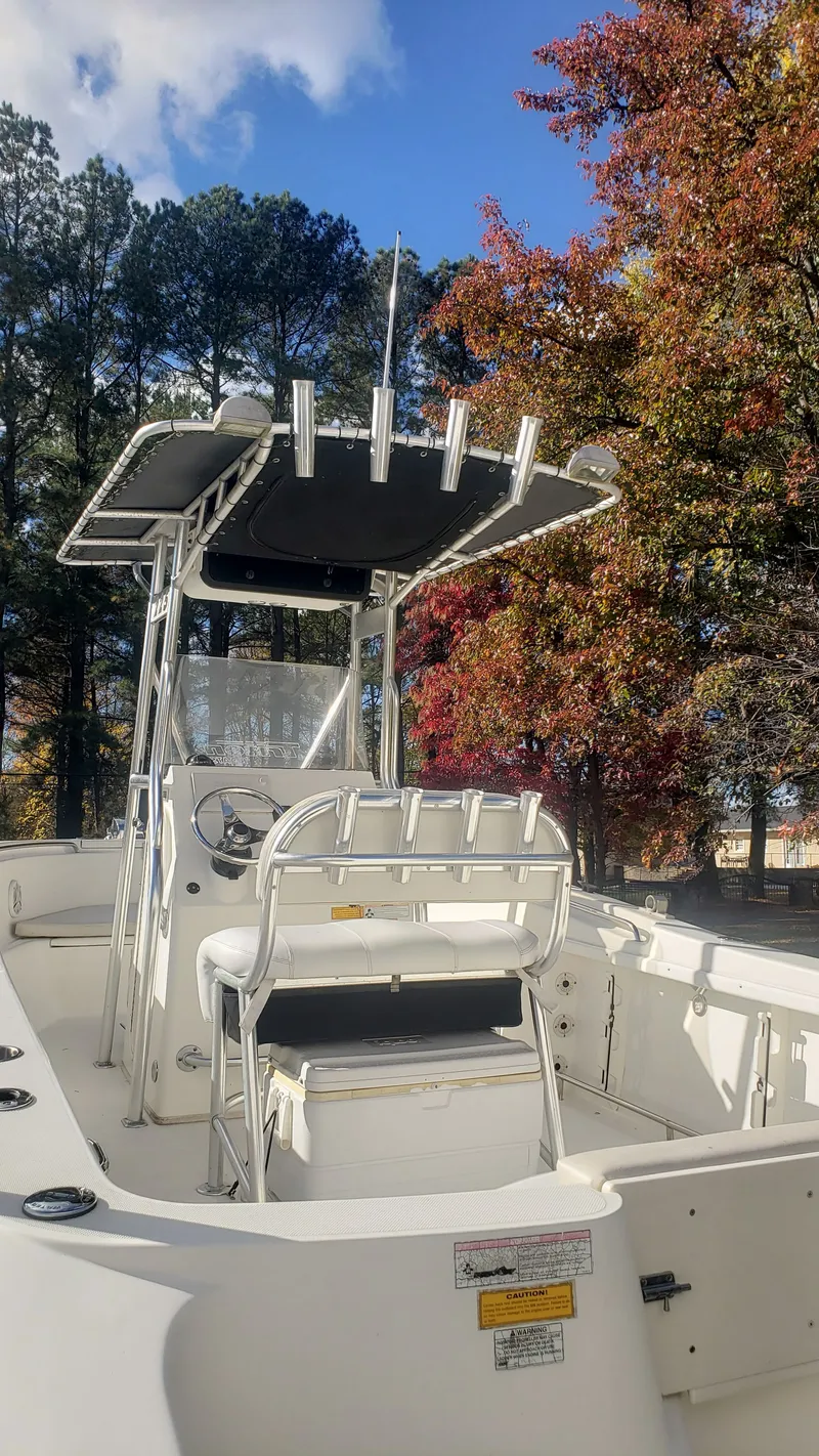 Slide: The Image of 2009 Triton 225 CC boat in autumn forest. - 34