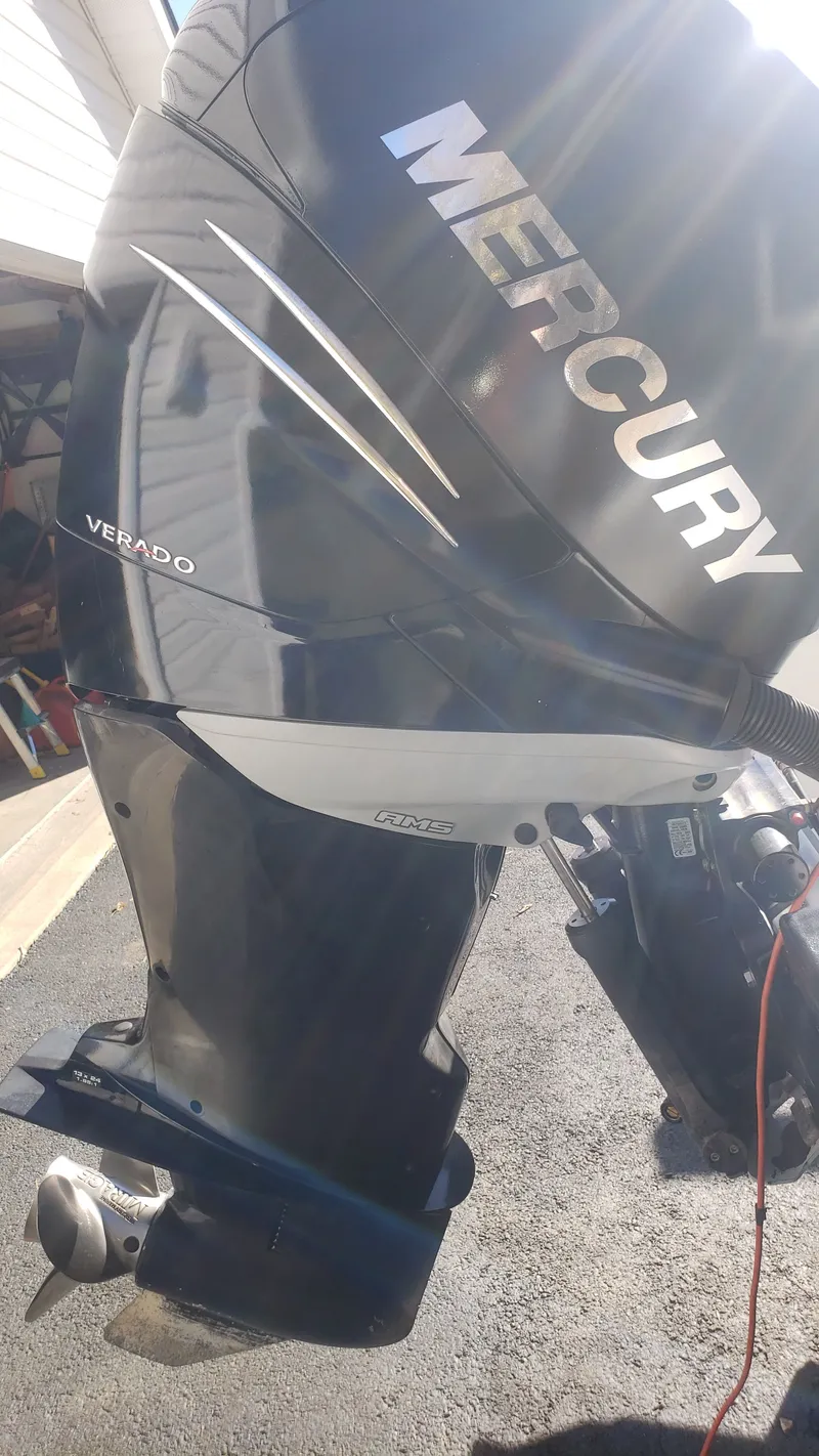 Slide: The Image of Mercury Verado outboard motor on a 2009 Triton 225 CC boat. - 38