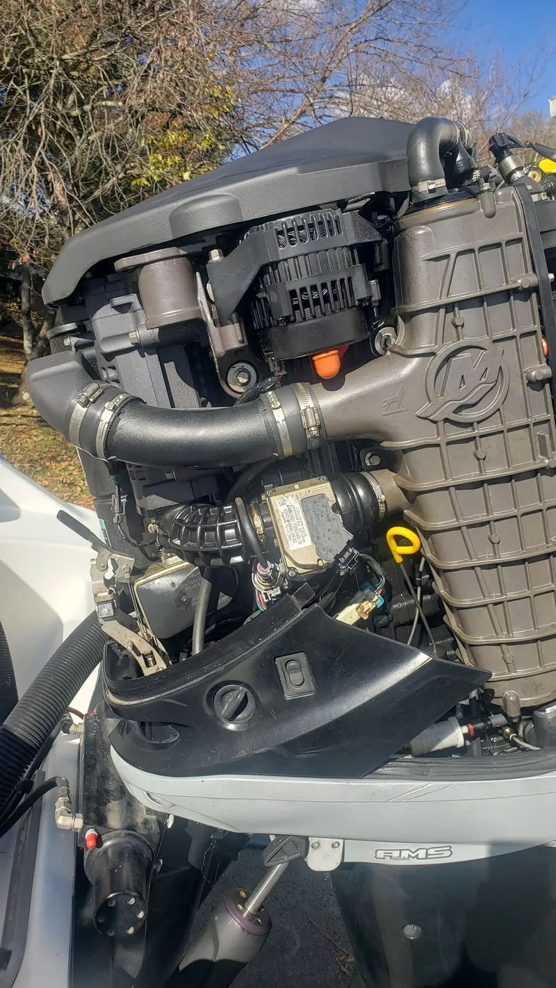 Slide: The Image of Close-up of a 2009 Triton 225 CC outboard motor. - 39