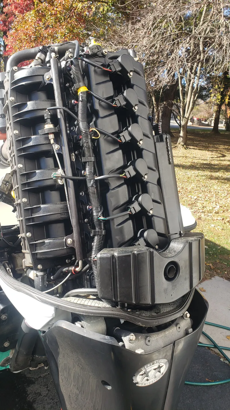 Slide: The Image of Close-up of a 2009 Triton 225 CC outboard motor outdoors. - 40