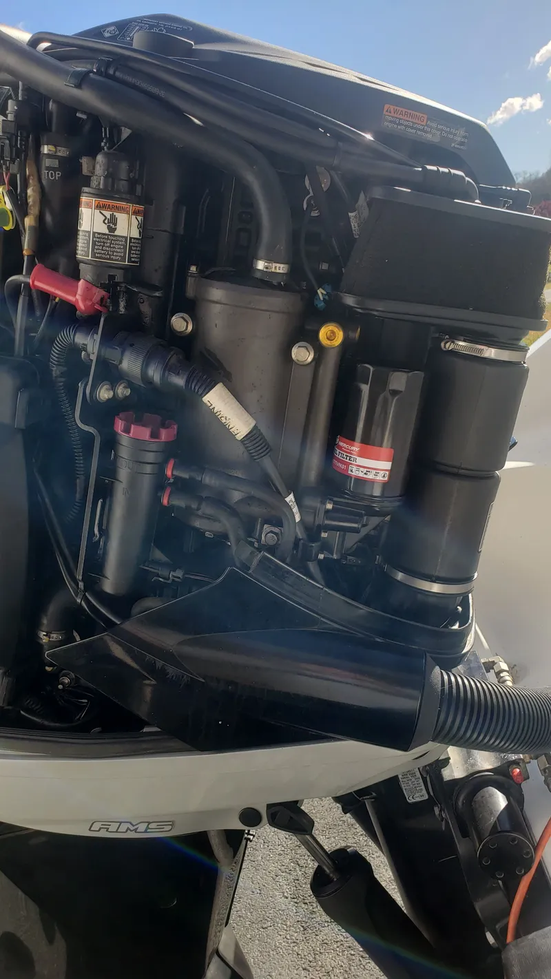 Slide: The Image of Close-up of a 2009 Triton 225 CC boat engine. - 42