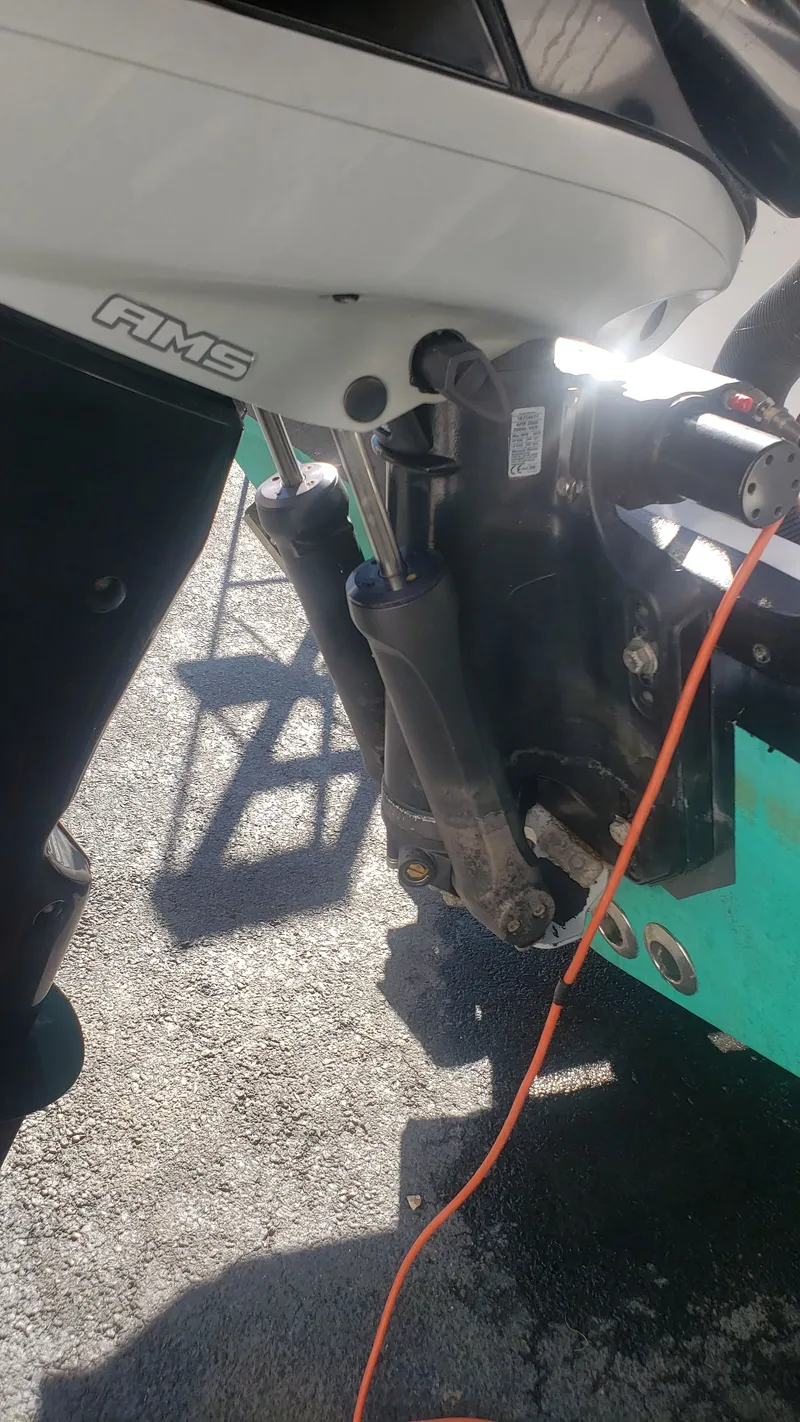 Slide: The Image of Close-up of a 2009 Triton 225 CC boat motor. - 44