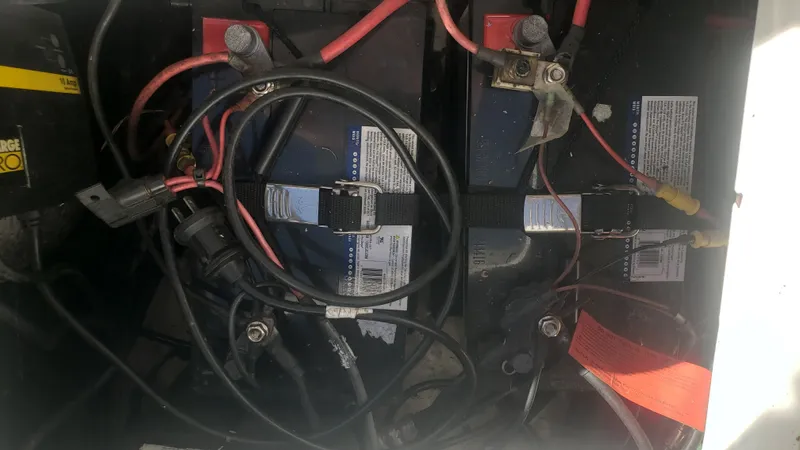 Slide: The Image of Batteries and wiring in a 2009 Triton 225 CC boat. - 45