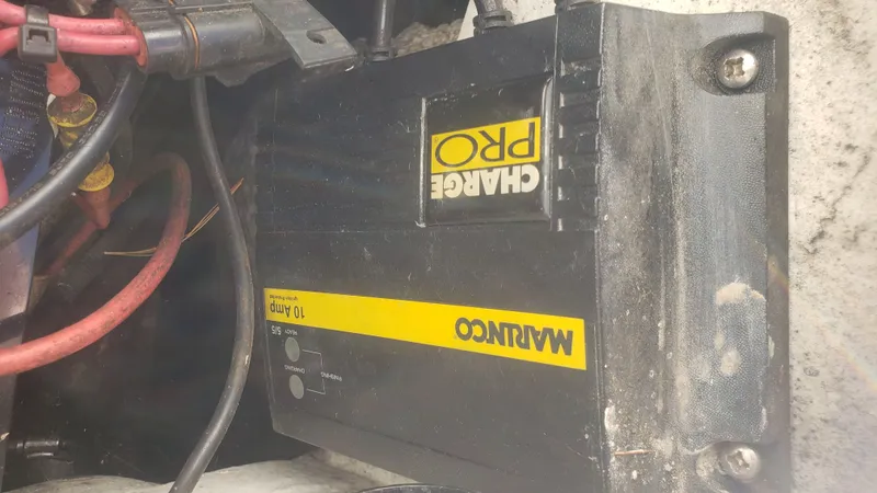 Slide: The Image of Marinco Pro Charge 10 Amp charger in Triton 225 CC boat. - 49