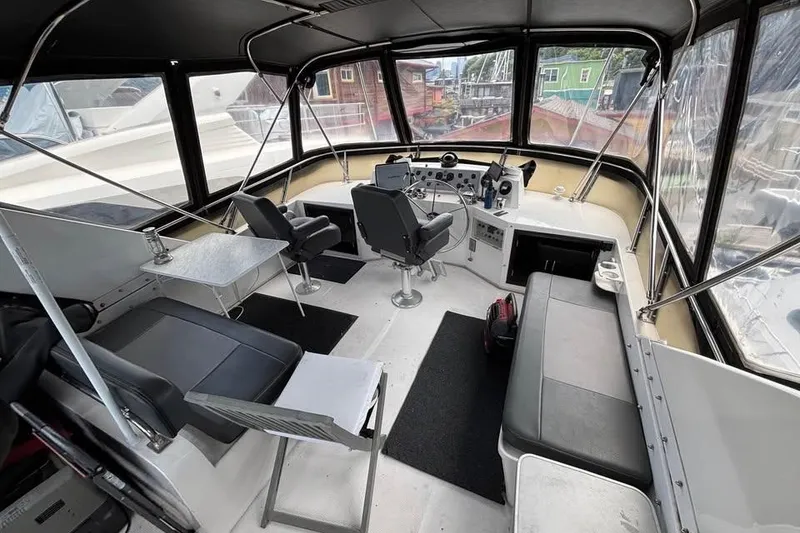 Slide: The Image of Interior of 1990 Ocean Alexander 420 Sport Sedan yacht cockpit with seating and controls. - 11