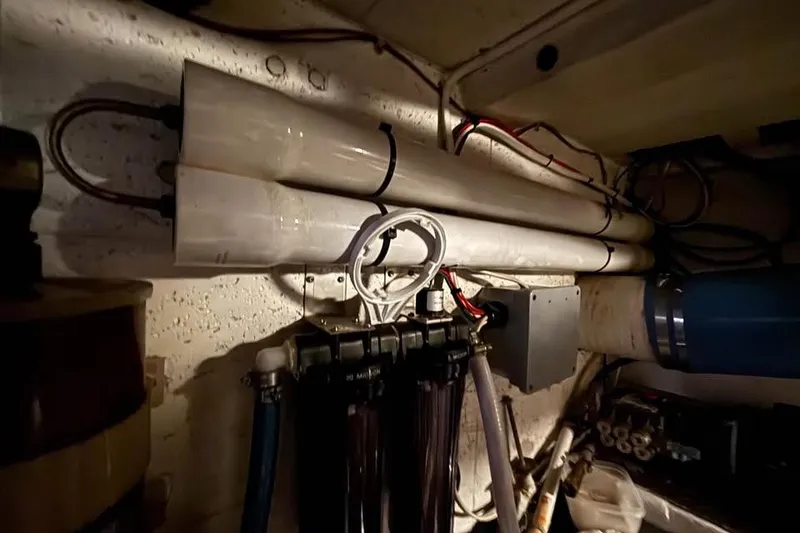 Slide: The Image of Engine room of 1990 Ocean Alexander 420 Sport Sedan with visible wiring and components. - 16