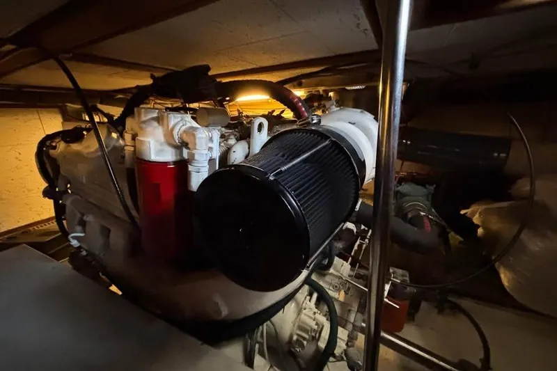 Slide: The Image of Engine room of 1990 Ocean Alexander 420 Sport Sedan, showcasing mechanical components. - 18