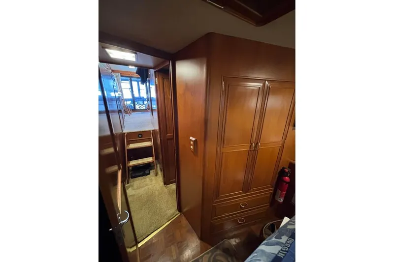 Slide: The Image of Interior of 1990 Ocean Alexander 420 Sport Sedan with wooden cabinetry and hallway view. - 9