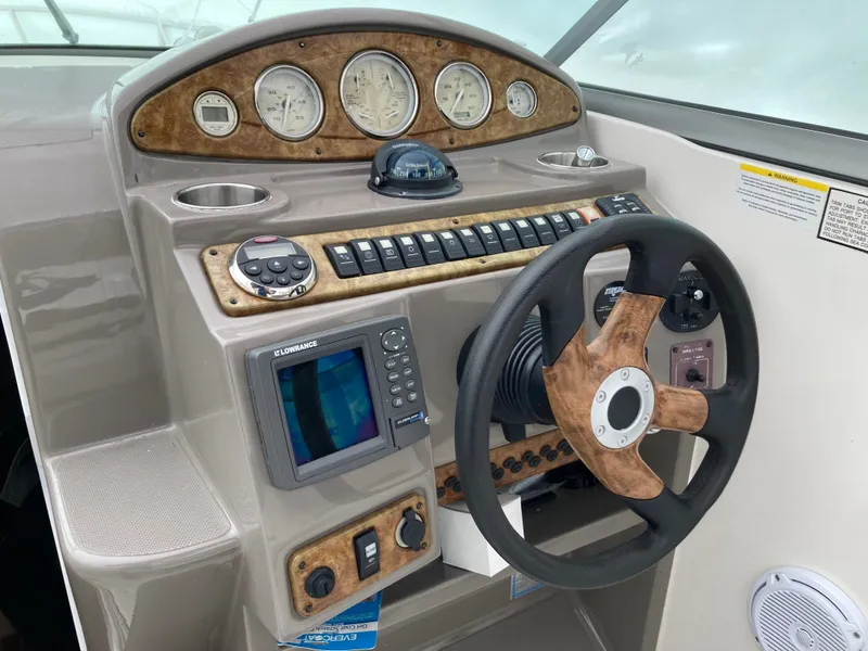 Slide: The Image of 2007 Rinker 280 Express Cruiser helm with instruments and controls. - 12
